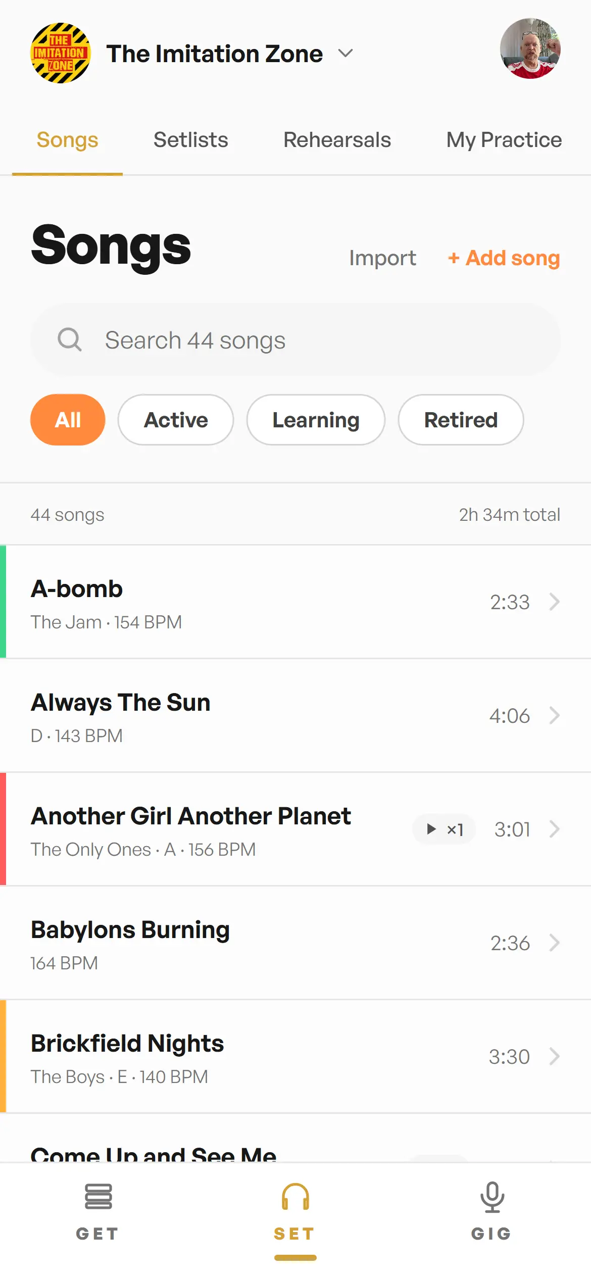 Songs library with practice-status colour stripes, BPM, key, filter chips